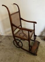 A Victorian Bergere wheel chair