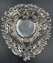 A silver heart shaped pin dish, hallmarked for Birmingham by Matthew John Jessop 1897.