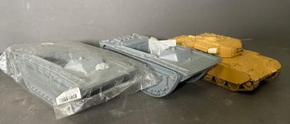 A Britain's toy tank and two plastic model kit troop transporter unpainted chassis AF