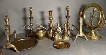 A quantity of brass items to include candlestick, fire dogs and a mirror