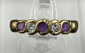 An 18ct gold amethyst and cubic, zircona half hoop eternity ring Size K