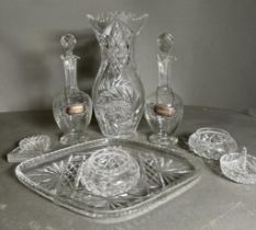 A selection of cut glass items to include two decanters with silver hallmarked tags