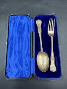 A hallmarked silver christening set of spoon and fork, hallmarked for Sheffield 1914 by Henry Hobson