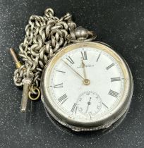 A silver pocket watch AWW Co marked Waltham Mass with silver Albert chain and key