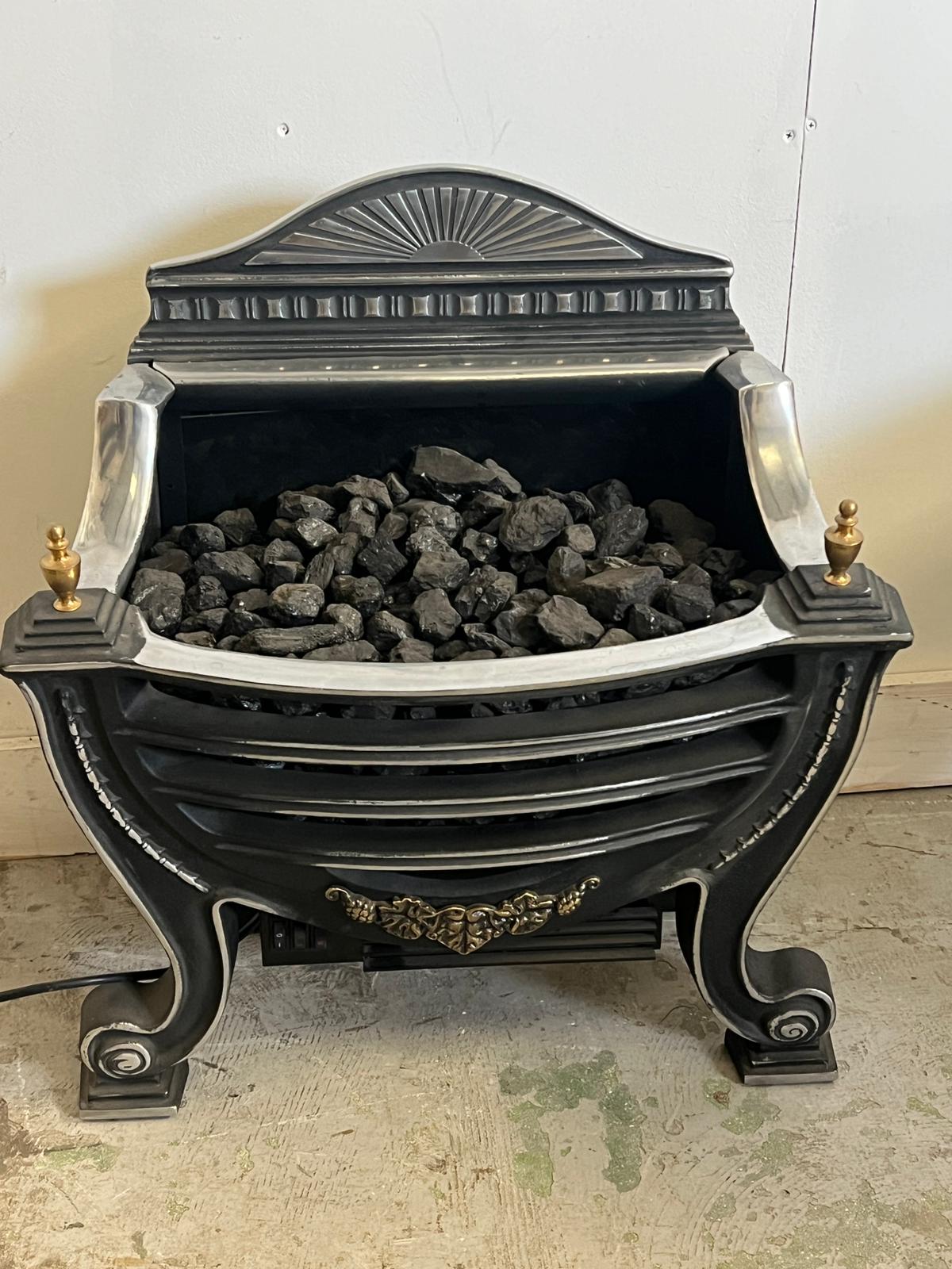 An electric fire/heater with cast iron style grate (H62cm W58cm)