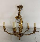 A French five branch gilt chandelier with central cherub detail