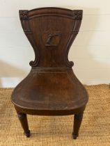 A Victorian shield back hall chair