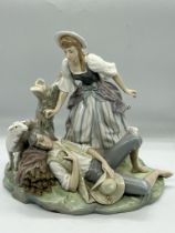 Lladro figurine porcelain "girl wakes boy on hay" (H28cm W29cm)