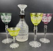 A selection of Val Saint Lambert coloured crystal glasses and a cut glass decanter with a silver