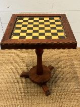 A wooden gamed table, the table unscrews for easy storage (H57cm Sq43cm)