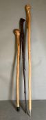 Three wooden carved and whittled walking sticks various woods