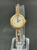 A 9ct gold J W Benson ladies wristwatch on expandable bracelet.Approximate total weight 19.4g