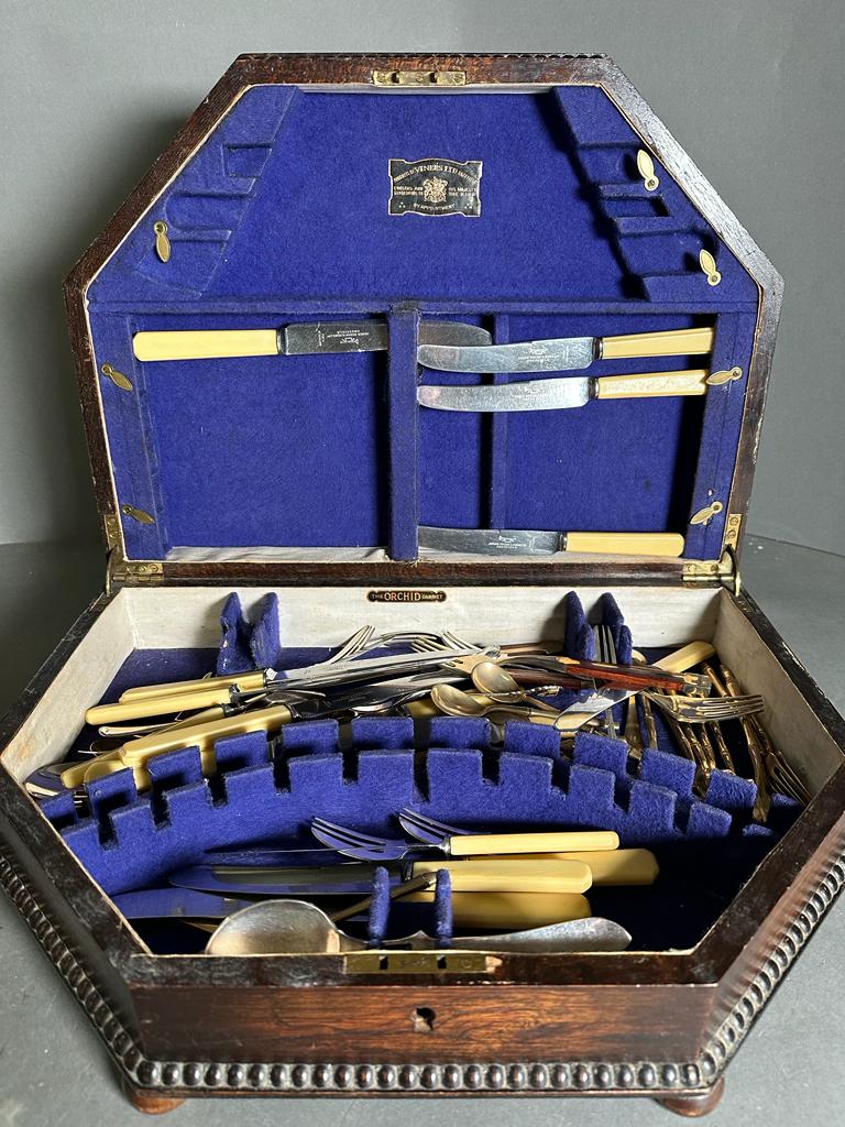 A box of mixed flatware various styles