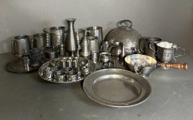 A selection of pewter and white metal items to include tankards, plates and napkin rings