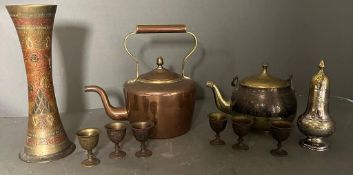 A selection of brass and copper items to include tea pots, egg cups and a sugar shaker