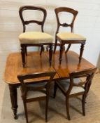 A Regency style mahogany extendable table with six chairs of two different styles (H73cm W144cm