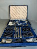 A twelve place setting canteen of cutlery by SBS in a blue leather case.