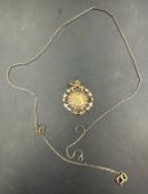 An 18ct gold pendant of Our Lady (Approximate weight 1.7g) and a 9ct gold chain (Approximate