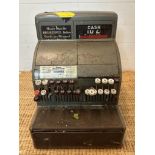 A vintage national cash register with key