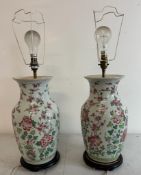 A pair of Chinese ceramic vase table lamps with floral decoration