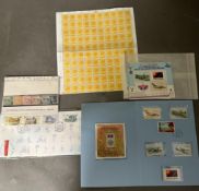 A selection of UK and World stamps to include a sheet of 100 x 10 1/2 pence Uk stamps, mint