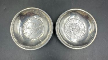 Two Chinese silver coin pin dishes with a combined approximate weight of 100g