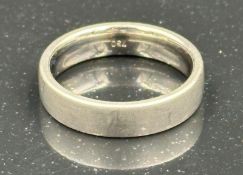 An 18ct white gold wedding band, approximate size Q and weight 9.3g