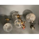 Four globe style, wall hanging lights and ceiling lights