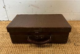 A small vintage brown leather case