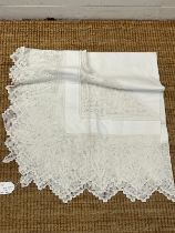 A white table cloth with crooked edge