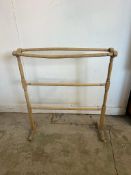 A vintage pine free standing towel rail