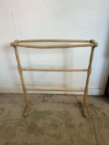 A vintage pine free standing towel rail