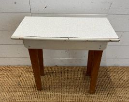 A small white Formica topped side table (H47cm W54cm D28cm)
