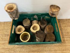 A selection of wooden rustic candle holders and logs