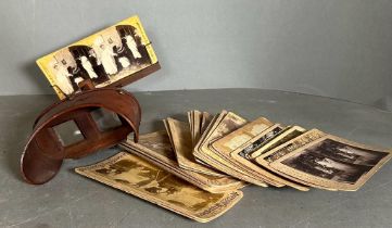 A stereoscope with a variety of cards to include:Niagra Falls, English and Foreign scenery etc.