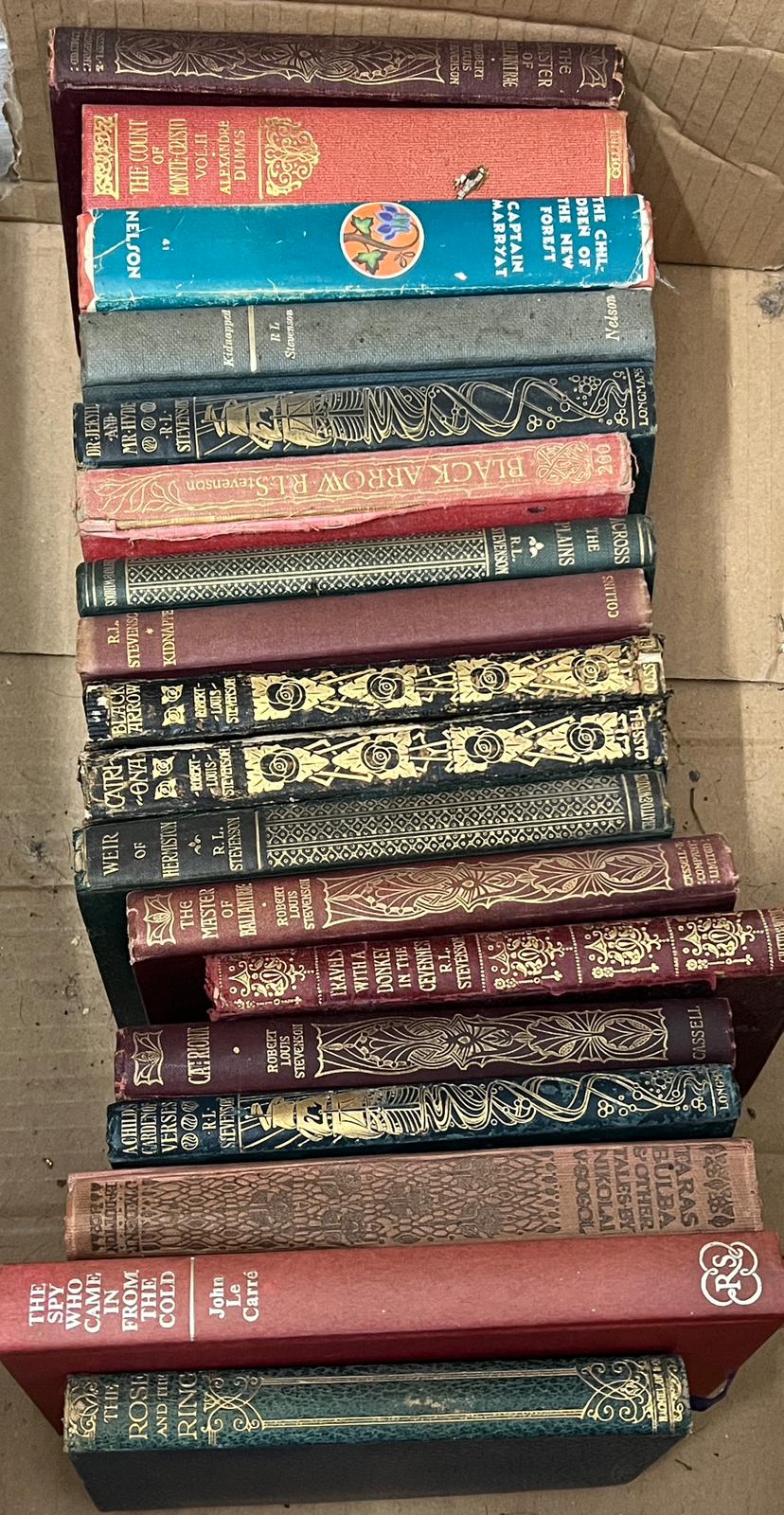A selection of hard back books, Robert Louis Stevenson and John Le Carre
