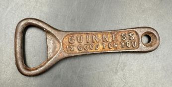 A vintage "Guinness Is Good For You" bottle opener