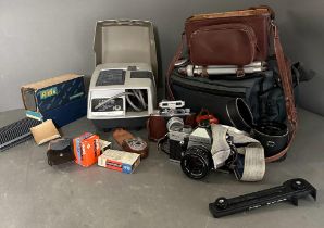 A Halina camera and camera equipment along with an Aldis slide projector and a Praktica 35mm