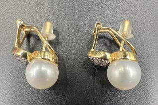 A pair of 14ct gold pearl and diamond earrings