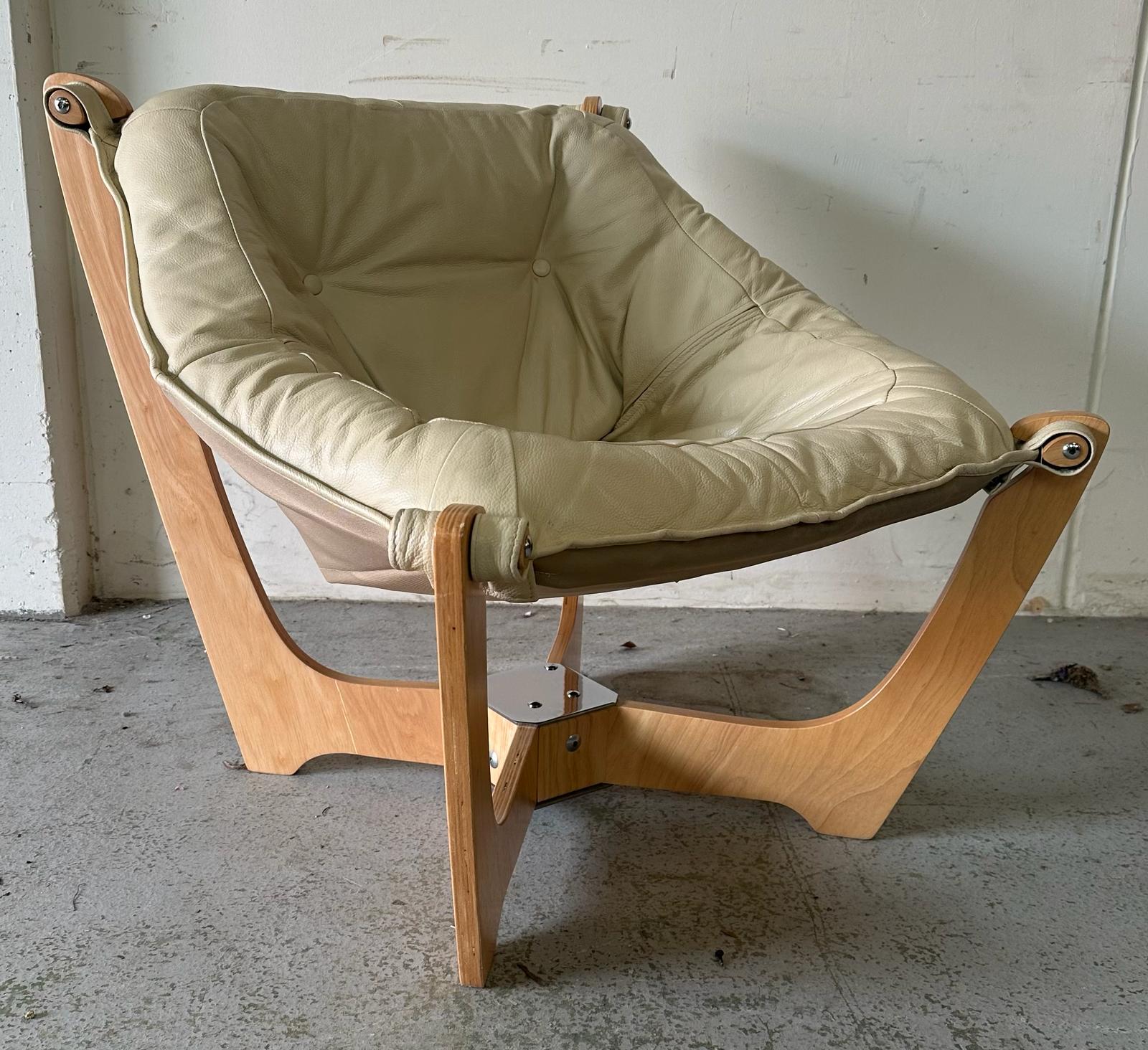 A cream leather button Huffel Lunar chair on a wooden and chrome base AF