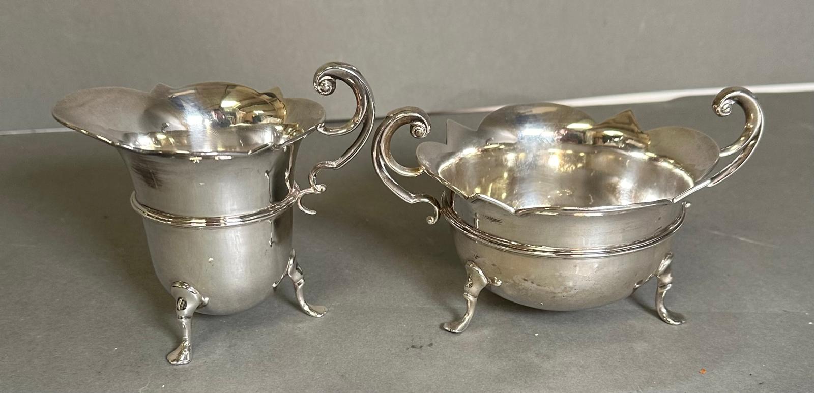 A three piece silver tea service to include a teapot, milk jug, and sugar bowl by Watson & Gillott - Image 5 of 5