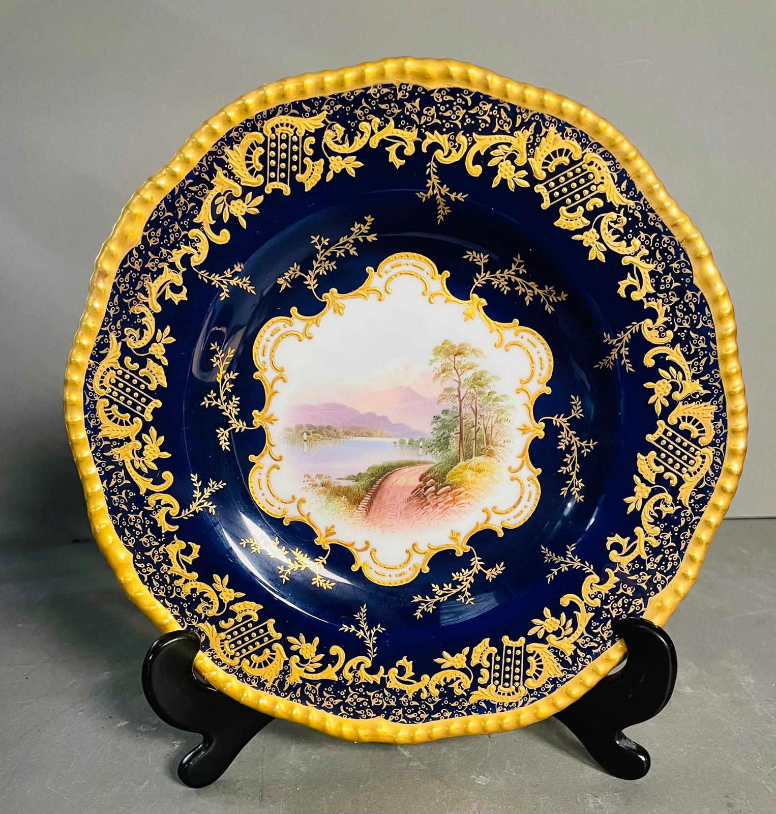 A selection of five early 20th century Coalport hand painted plates with blue grounds, under an acid - Image 3 of 12