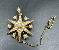 A Victorian star brooch with seed pearl decoration on 15ct yellow gold, with an approximate weight