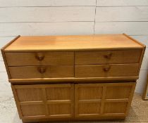 A Mid Century four drawer, two cupboard sideboard by Nathan (H76cm W102cm D45cm)