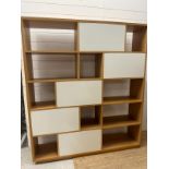 A contemporary geometric fifteen compartment bookcase (H180cm W158cm D33cm)