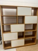 A contemporary geometric fifteen compartment bookcase (H180cm W158cm D33cm)