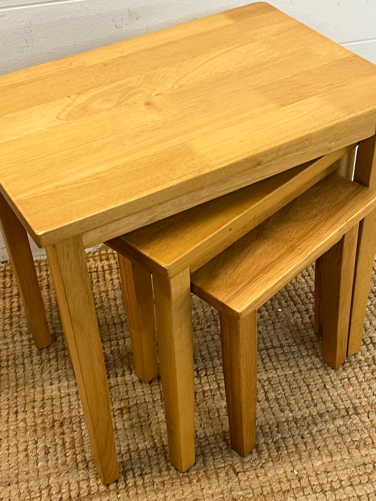 A set of light oak nesting tables (H46cm W48cm D33cm) - Image 2 of 2