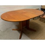 A Mid Century oval drop leaf dining table by G-Plan (H74cm W150cm D100cm)
