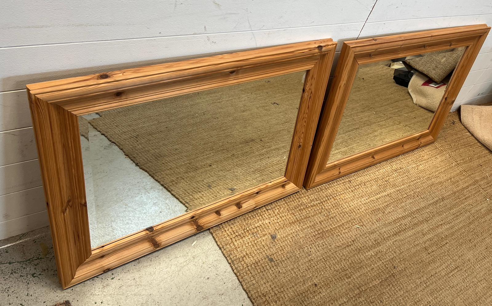 A pair of pine mirrors 94cm x 67cm