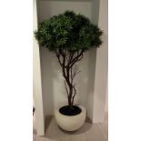 An artificial tree in a white pot (H210cm)